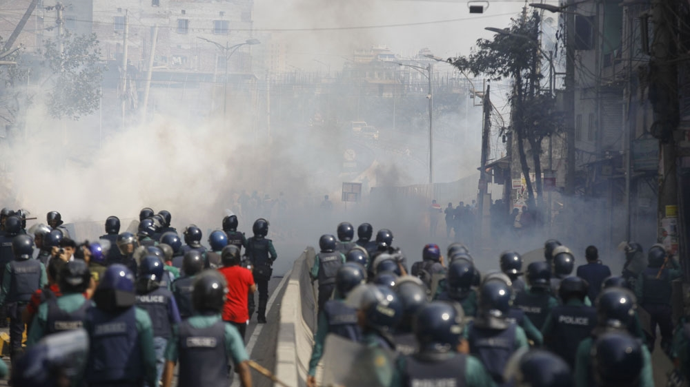 Police fire tear gas to disperse BNP supporters protesting Khaleda Zia's sentencing in Dhaka
